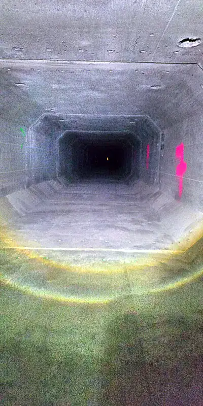 A long dark storm drain sump