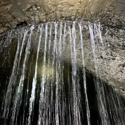Water pouring into a pipe from the crown through a compromised joint