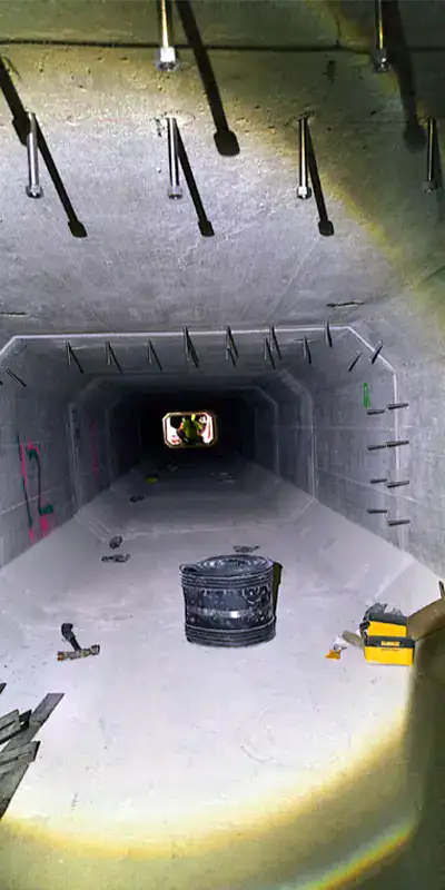 A long storm drain sump with anchors on either side of the joints