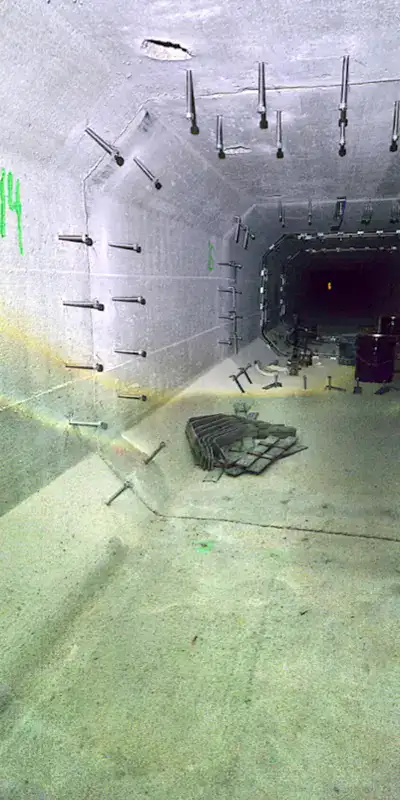 A long storm drain sump with anchors on either side of the joints