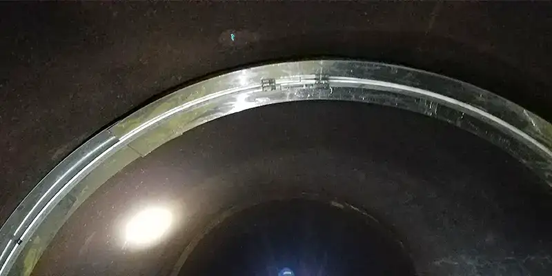 A backing plate over a joint in a drinking water line
