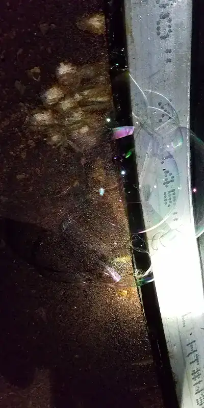 Bubbles escaping from underneath a HydraTite seal, denoting minor alternations needed
