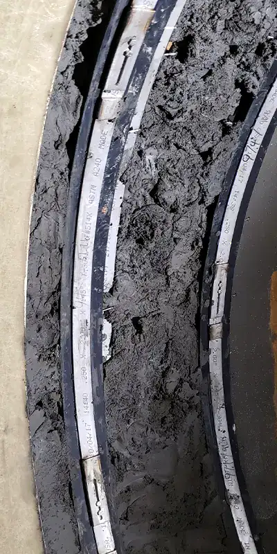 Concrete packed into a pipe joint to help transition a joint