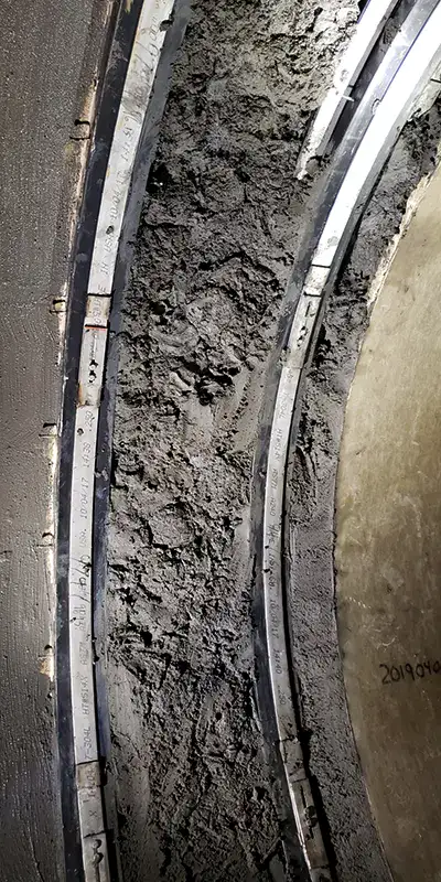 Concrete packed into a pipe joint to help transition a joint