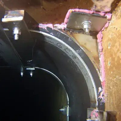 The corner of a HydraTite seal installed in an underwater box-shaped chamber