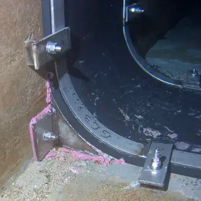 The corner of a HydraTite seal installed in an underwater box-shaped chamber