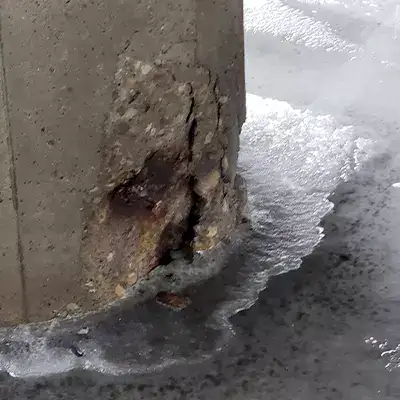 A damaged portion of concrete in a bridge's pier cap
