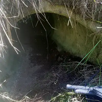 Looking down on the opening of a culvert