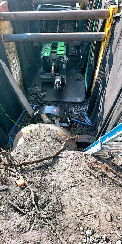 An open pipe with ventilation set up to keep the confined space workers safe