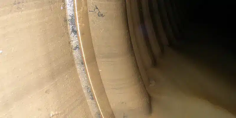 A muddy internal pipe joint seal protecting a joint