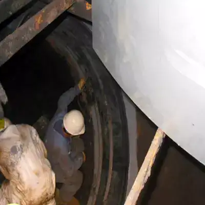 A technician installing HydraTite over an expansion joint