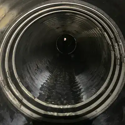 HydraTite installed with three retaining bands over a joint in an ADS pipe
