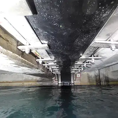 HydraTite installed over a joint in a box-shaped pipe that is nearly full of water
