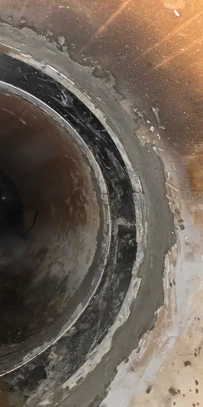 HydraTite installed over a joint with grout coating the edges