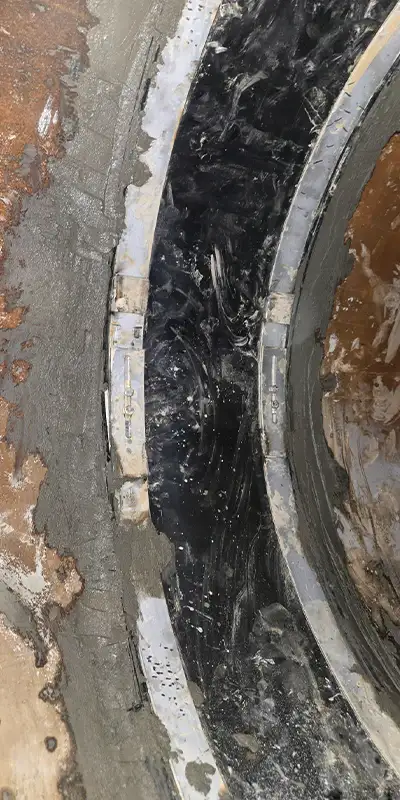 HydraTite installed over a joint with grout coating the edges