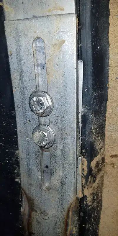 A stainless steel retaining band locking a HydraTite seal over a joint in a stormwater pipe