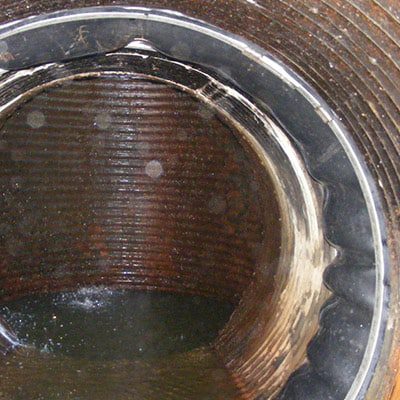 HydraTite Installed Over A Joint In A Corrugated Overflow Pipe
