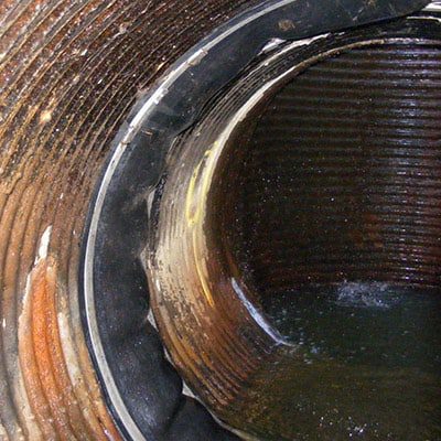 HydraTite Installed Over A Joint In A Corrugated Overflow Pipe