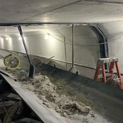 HydraTite being positioned over a joint in a box-shaped pipe
