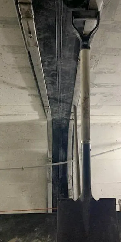 HydraTite being positioned over a joint in a box-shaped pipe