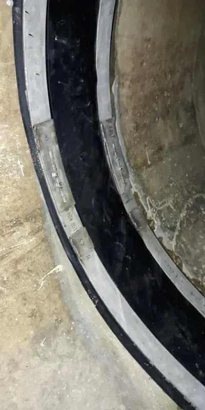 HydraTite installed over a joint in a pipe that has ice on the invert