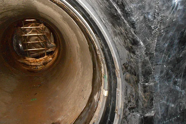 HydraWrap applied to the interior of this cooling water piping with HydraTite installed over the edge of the fabric