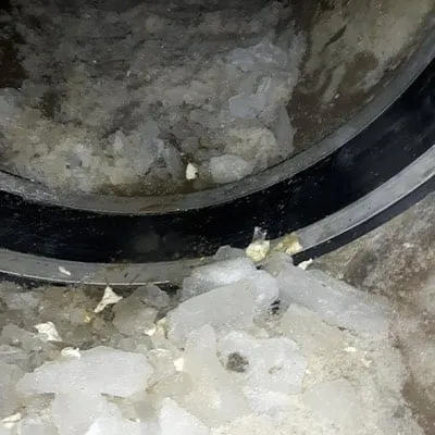 HydraTite installed over a joint in a pipe that has ice on the invert