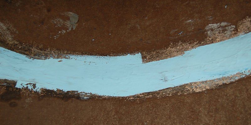 A joint in a PCCP that has had its surface coated in epoxy