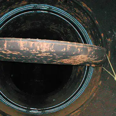 HydraTite installed over an expansion joint coated in HydraLine just beyond a butterfly valve