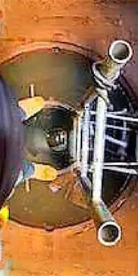 looking down on a ladder that allow entry to a pipe