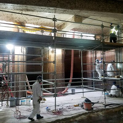 Technicians working on the inside of an expansion