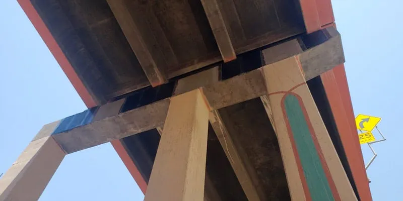 Portions of a bridge's supports wrapped in carbon fiber wrap