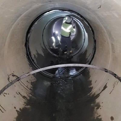 Several technicians installing HydraTite over joint