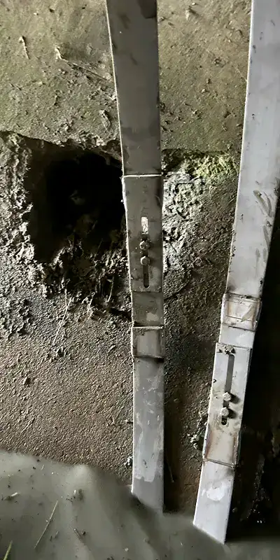 Two steel retaining bands sitting inside a pipe