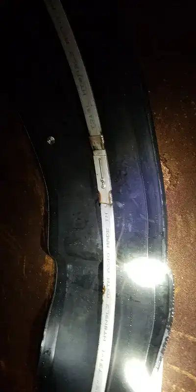 A rubber seal loosely held in place with a retaining band that is not yet locked