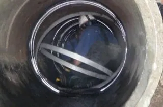 HydraTite being installed over joints in a pipe