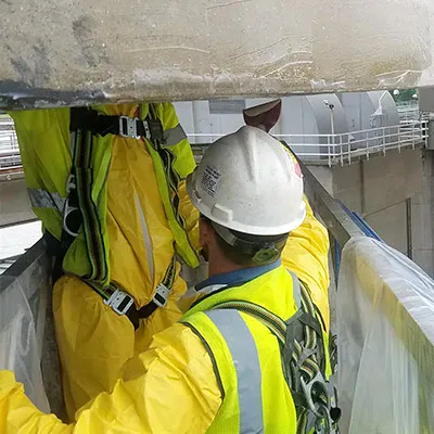 A couple technicians restoring a bridge