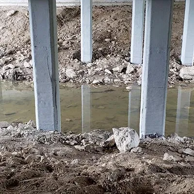 Glass fiber wrap, and a cementitious coating applied to spalling concrete to restore them