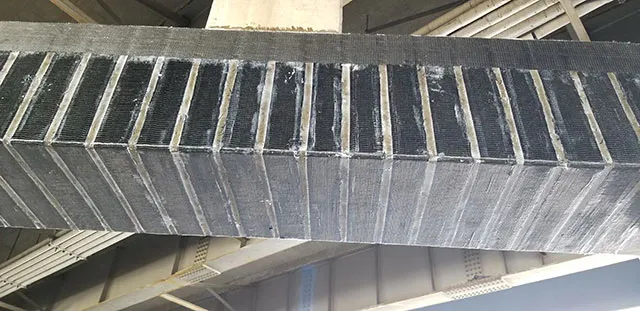 Carbon fiber composite system applied to the pier cap of a bridge