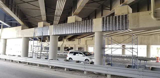 Carbon fiber composite system applied to the pier cap of a bridge