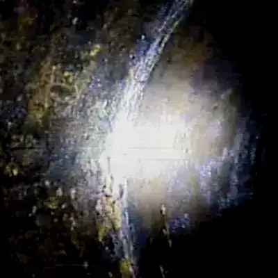 A light being shown on a pipe joint