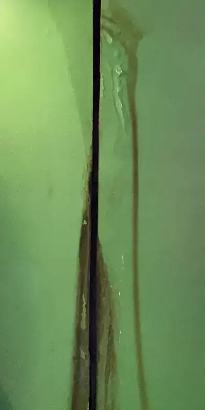 A leaking joint in a PVC pipe