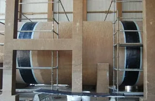 Multiple joints of a large circulating cooling water line wrapped in HydraWrap