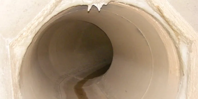 An irregular transition between 70 inch steel pipe and a rectangular concrete pipe. This joint has become compromised.