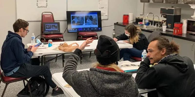 Several employees sitting for a training