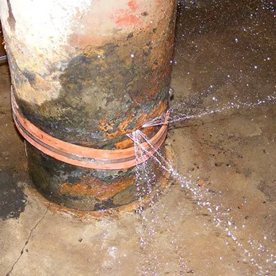 A very active leak in a compromised ash sluice pump intake manifolds