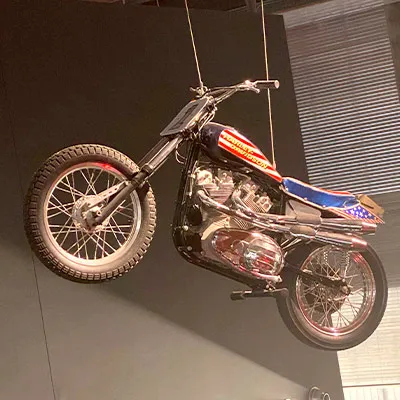 A motorcycle strung up as a decoration inside