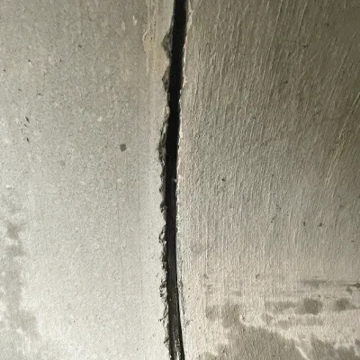 A separated joint in a concrete pipe under a roadway