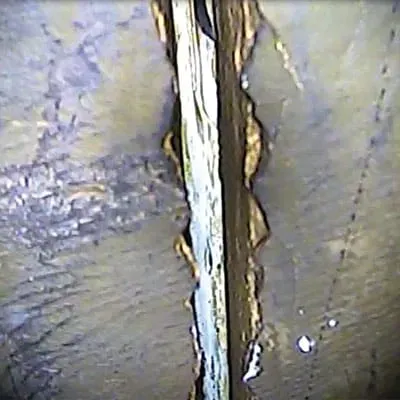 A separated pipe joint inside a submerged pipe
