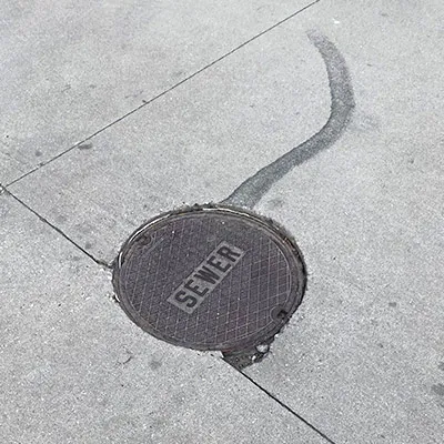 A sewer lid in the street